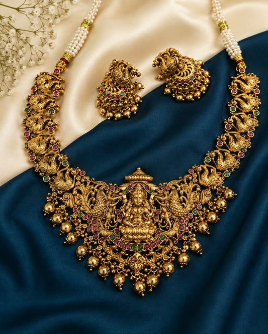Antique Gold Finish Lakshmi Temple Necklace Set with Kemp Stones, Pearl Chain & Matching Jhumka Earrings for Women